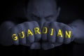 GUARDIAN written on an angry manÃ¢â¬â¢s fists